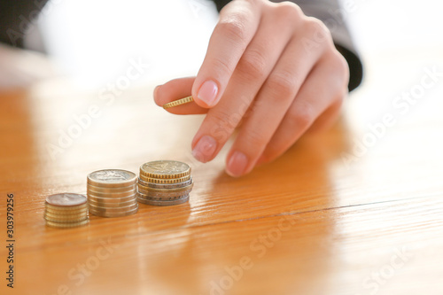 Woman counting coins at table