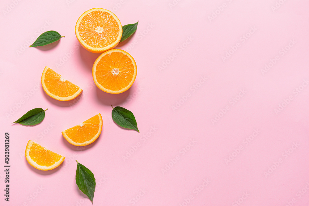 Fresh orange pieces on color background - obrazy, fototapety, plakaty 