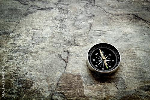 Compass - small and stylish - on grey background copy space