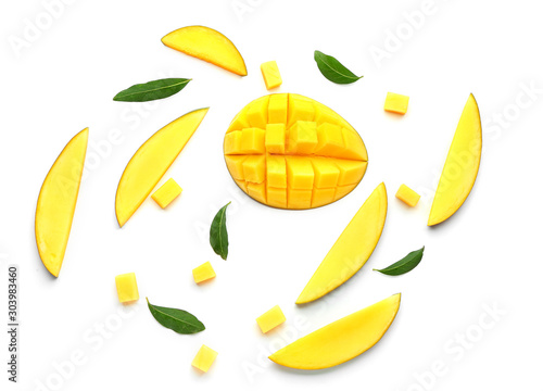 Pieces of tasty mango fruit on white background