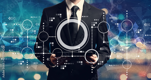 Connected circles chart with businessman holding a tablet computer