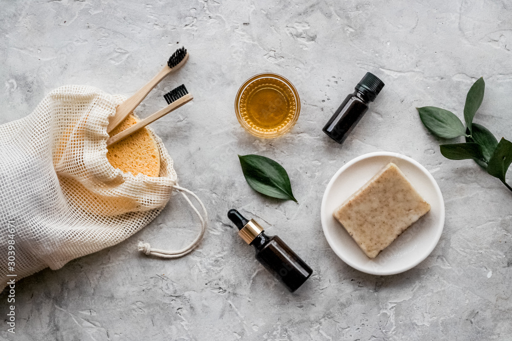 Self-care set based on essential oils on light grey background top view Self-care set based on essential oils on light grey background top view