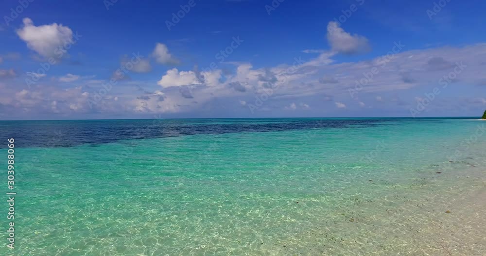 Barbados Island, Caribbean - White Sand and Beautiful Cloudy Blue Sky Above - Wide shot Barbados Island, Caribbean - White Sand and Beautiful Cloudy Blue Sky Above - Wide shot