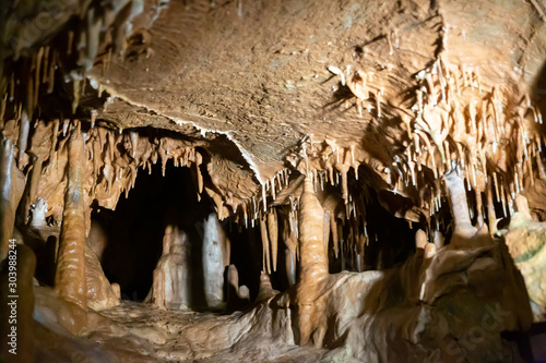 Stalactites, stalagmites and streak formations in cave of Balzarca. Moravian Karst. Czech Republic photo