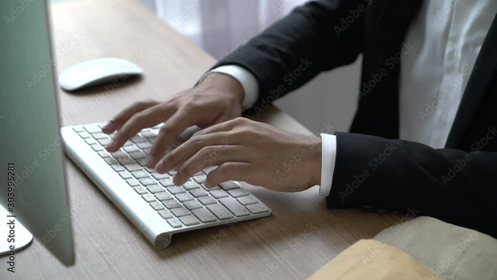 Close-up hand of businessman using computer Close-up hand of businessman using computer