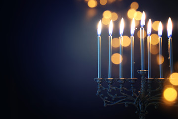 Religion image of jewish holiday Hanukkah background with menorah (traditional candelabra) and candles