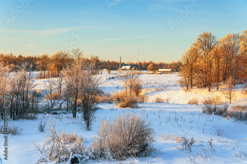 Rural landscape at sunset in winter.Novgorod oblast.Russia