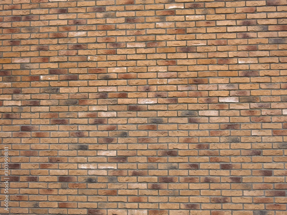 texture of beige or brown brick wall with colored bricks texture of beige or brown brick wall with colored bricks