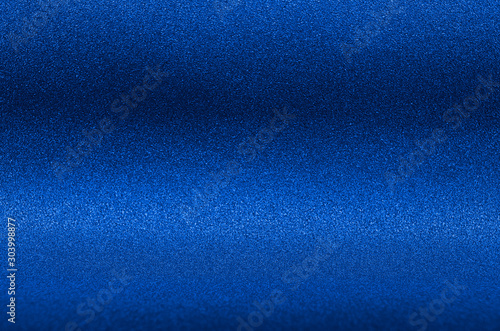 Ultramarine blue metallic glitter background for elegance rich luxury holiday design.