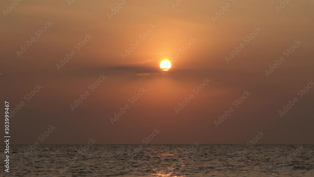 Beautiful sunset at the beach, amazing colors, light beam shining through the cloudscape over the arabian or Persian gulf seascape, united arab emirates. Dubai sea and beach Beautiful sunset at the beach, amazing colors, light beam shining through the cloudscape over the arabian or Persian gulf seascape, united arab emirates. Dubai sea and beach