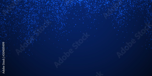 Magic stars sparse Christmas background. Subtle fl photo
