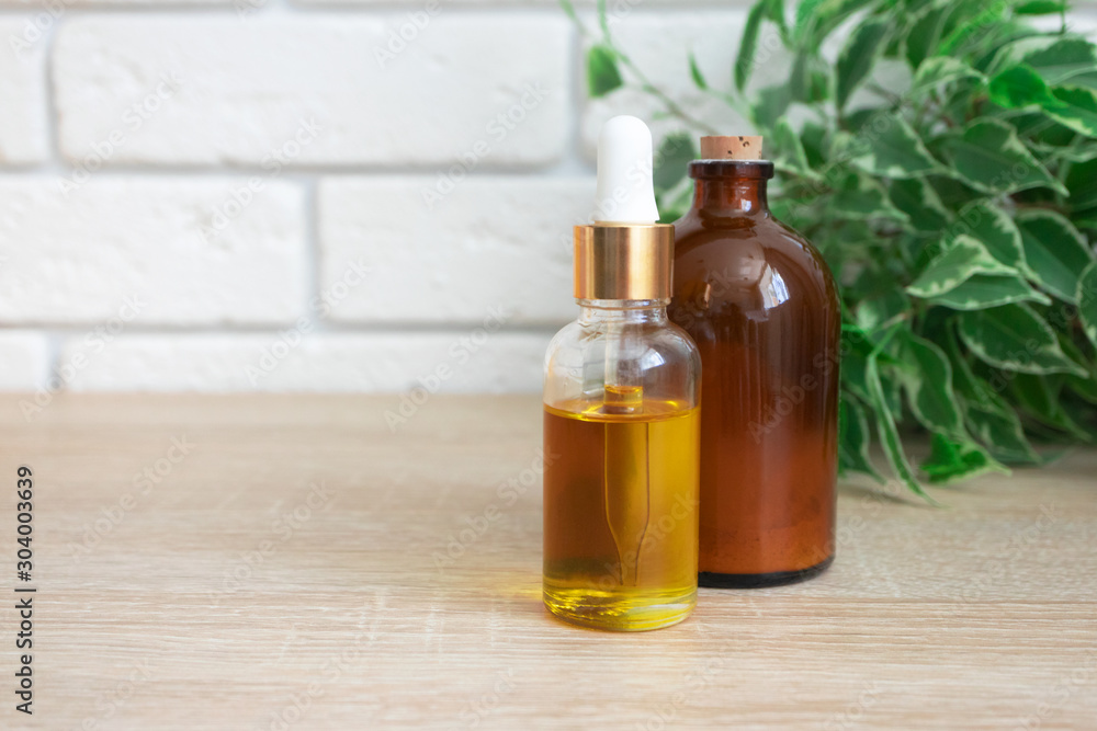 Glass bottles with oil serum and ubtan. Concept natural ogranic skincare cosmetic products Glass bottles with oil serum and ubtan. Concept natural ogranic skincare cosmetic products