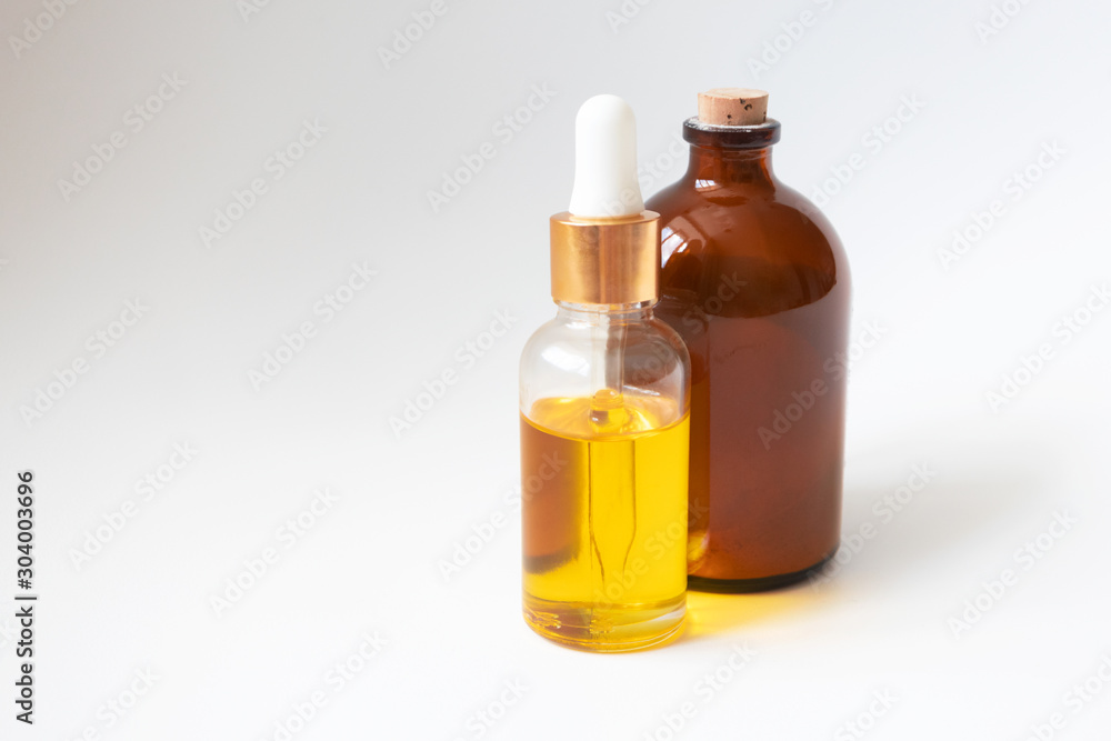 Oil serum glass bottle. Natural organic handmade cosmetic products on white background