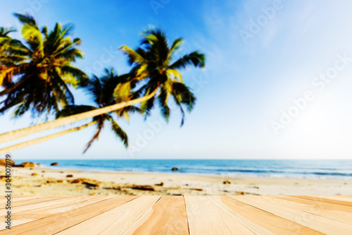 tropical beach with palm trees and wooden desk