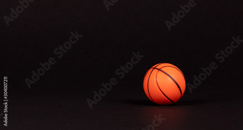 Single small rubber toy in form of basketball © michaklootwijk
