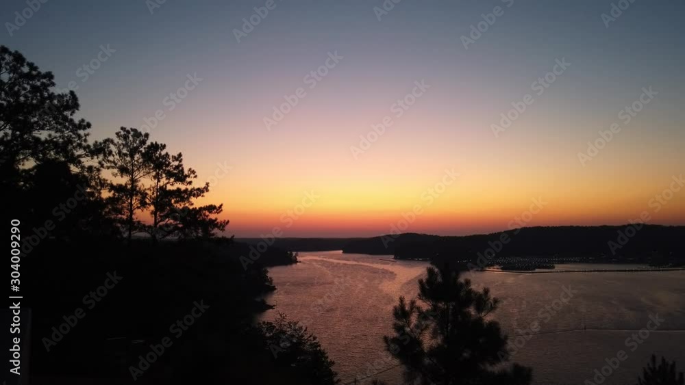 Orange sunset at a beautiful, quiet lake, static 4k shot, on summer evening. Orange sunset at a beautiful, quiet lake, static 4k shot, on summer evening.