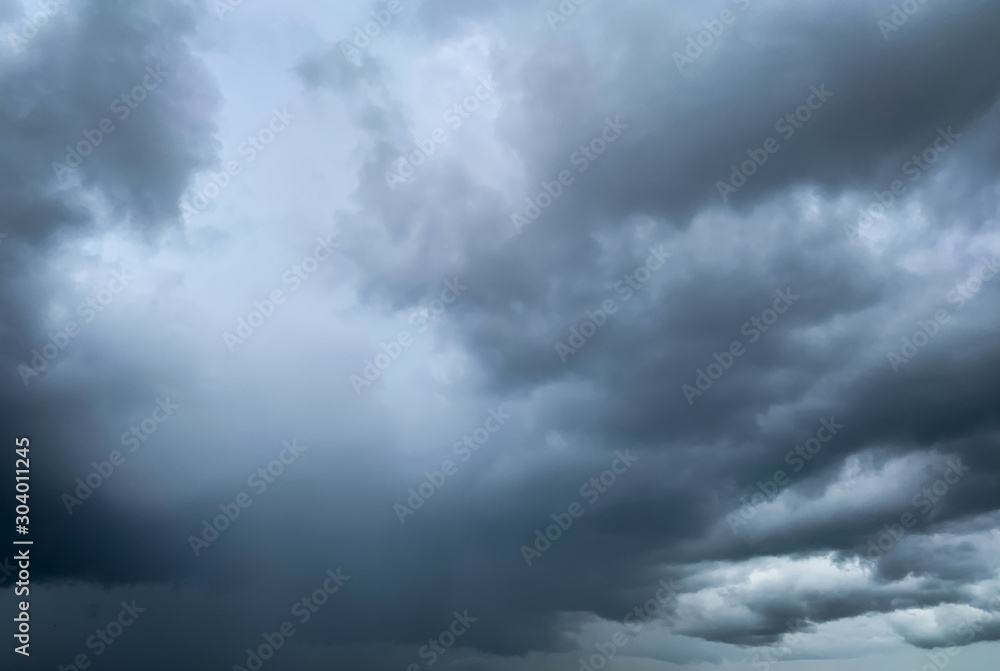 Dark dramatic sky and clouds. Background for death and sad concept. Gray sky and fluffy white clouds. Thunder and storm sky. Sad and moody sky. Nature background. Dead abstract background. Cloudscape. Dark dramatic sky and clouds. Background for death and sad concept. Gray sky and fluffy white clouds. Thunder and storm sky. Sad and moody sky. Nature background. Dead abstract background. Cloudscape.