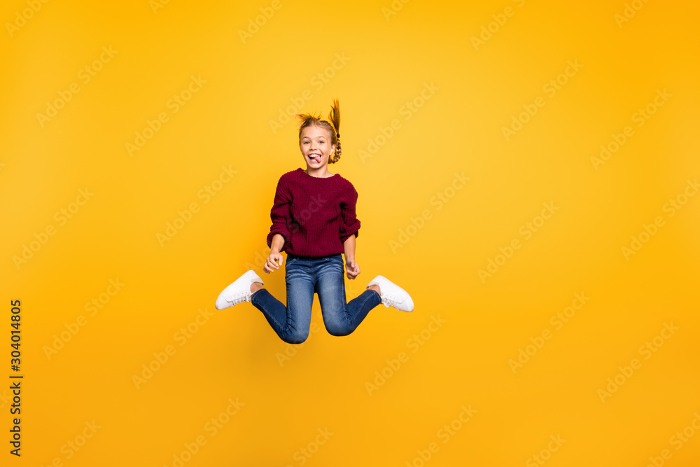 Full length body size view of her she nice attractive comic cheerful cheery playful pre-teen girl having fun jumping fooling grimacing isolated on bright vivid shine vibrant yellow color background