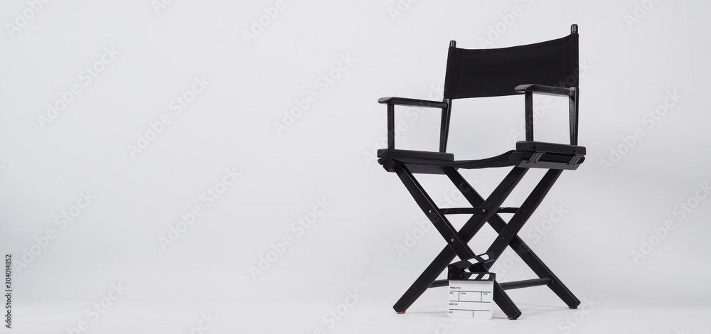 Small clapper board or movie slate with director chair use in video production or movie and cinema industry. It's put on white background. Small clapper board or movie slate with director chair use in video production or movie and cinema industry. It's put on white background.