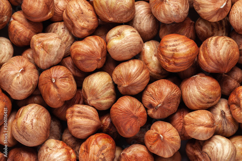 Hazelnut background. Peeled hazelnut kernels