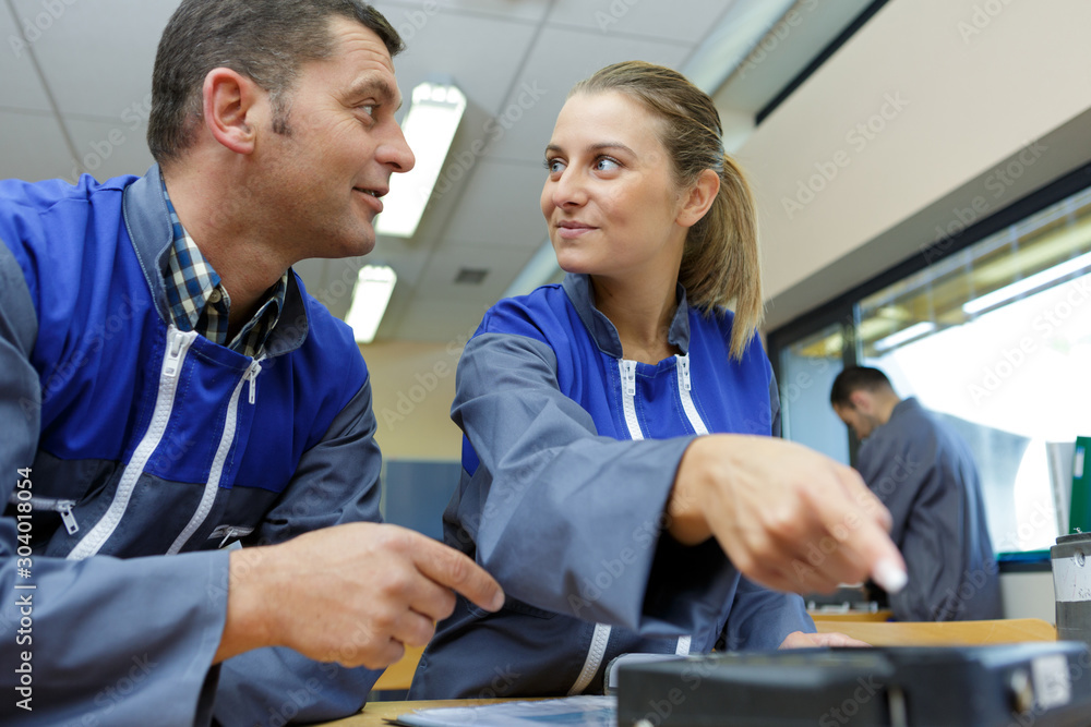 Obraz premium portrait of blue collar workers discussing something