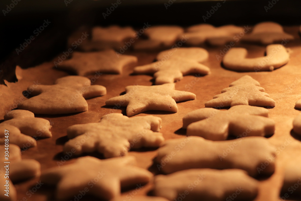Detail on christmas cookies in oven how grow up. Christmas mood is back. Biscuits from the whole family. Child and Mum together created beautiful and tasty christmas sweets Detail on christmas cookies in oven how grow up. Christmas mood is back. Biscuits from the whole family. Child and Mum together created beautiful and tasty christmas sweets