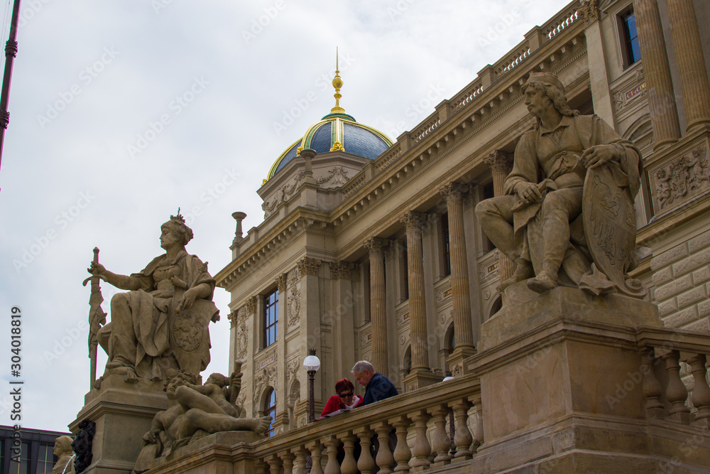 Facade of the Historical Building of the National Museum of Prague, one of the most important buildings in Prague, Czech Republic, located in Wenceslas Square, with statues at the foreground