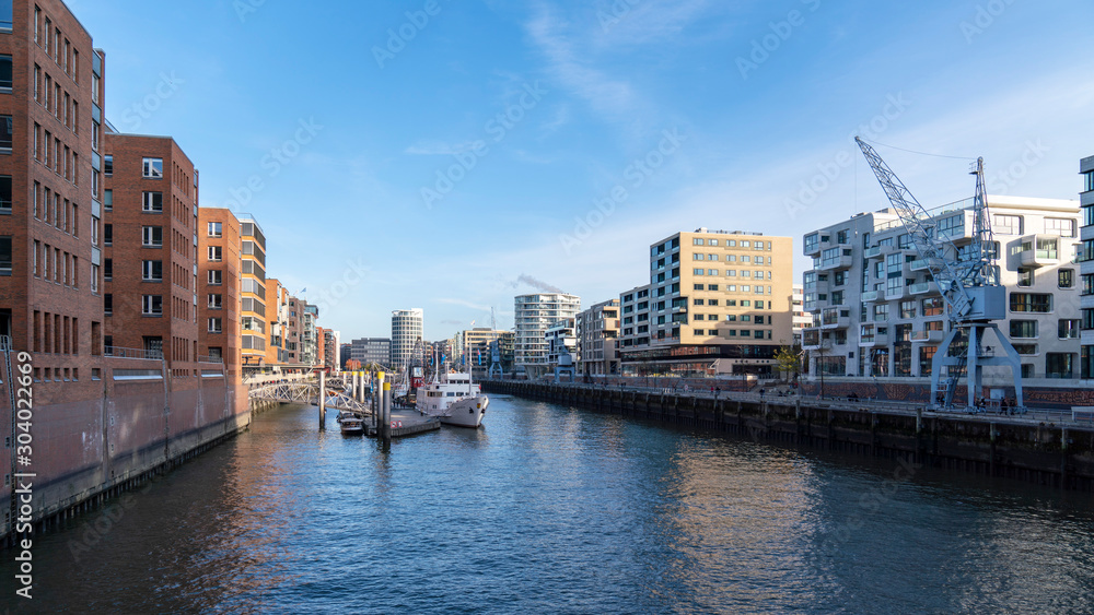 hafencity hamburg on a sunny day with boats cranes, germany hafencity hamburg on a sunny day with boats cranes, germany