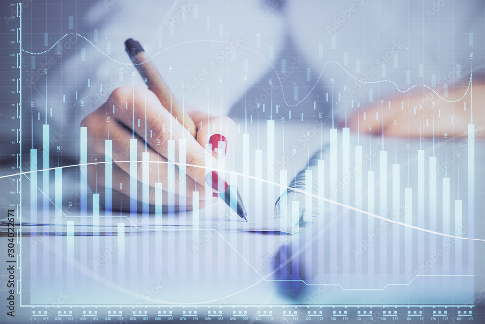 Double exposure of woman's hands making notes with forex graph hologram. Concept stock market analysis. Double exposure of woman's hands making notes with forex graph hologram. Concept stock market analysis.