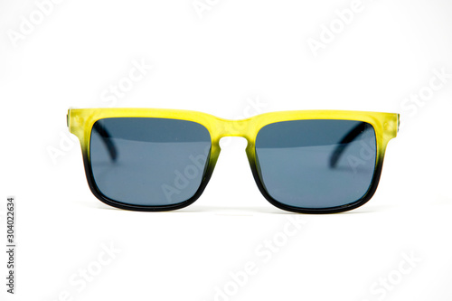 Blue and yellow sunglasses isolated over the white background