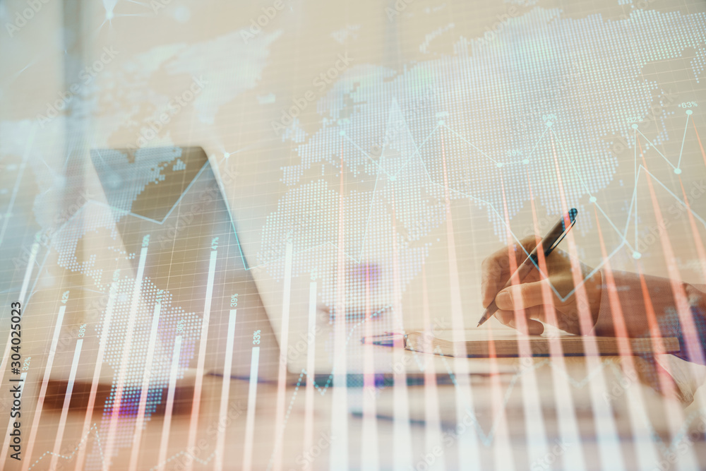 Double exposure of forex chart with man working on computer on background. Concept of market analysis. Double exposure of forex chart with man working on computer on background. Concept of market analysis.