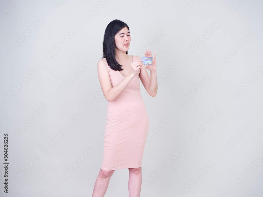 Portrait of young woman showing credit card Portrait of young woman showing credit card