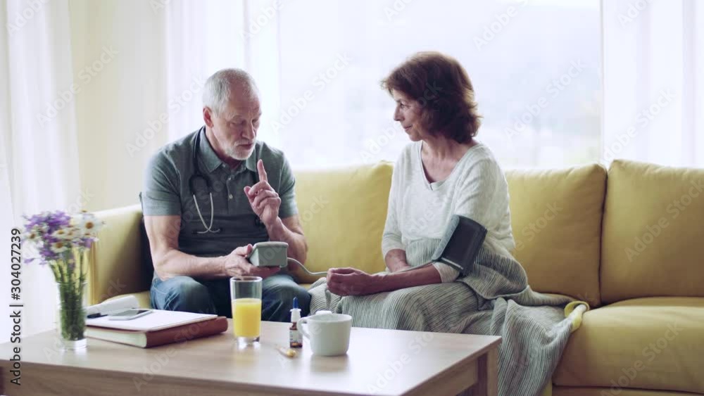 Health visitor and a senior woman during home visit. Health visitor and a senior woman during home visit.
