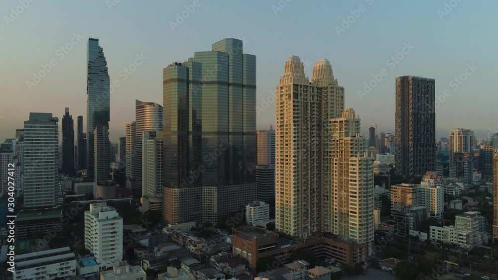 Bangkok's tallest skyscrapers with clear blue sky at dusk, aerial view Bangkok's tallest skyscrapers with clear blue sky at dusk, aerial view