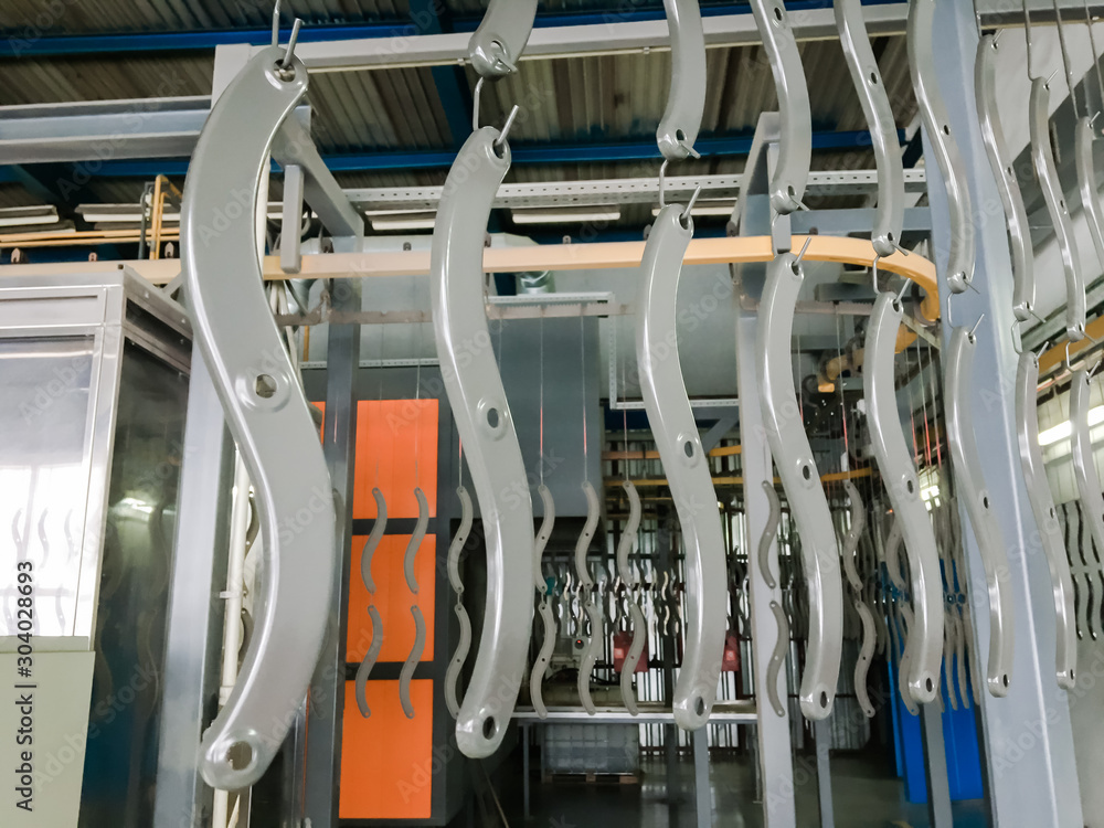 Powder coating line. Industrial interior. Workshop equipped with conveyors. Powder coating line. Industrial interior. Workshop equipped with conveyors.
