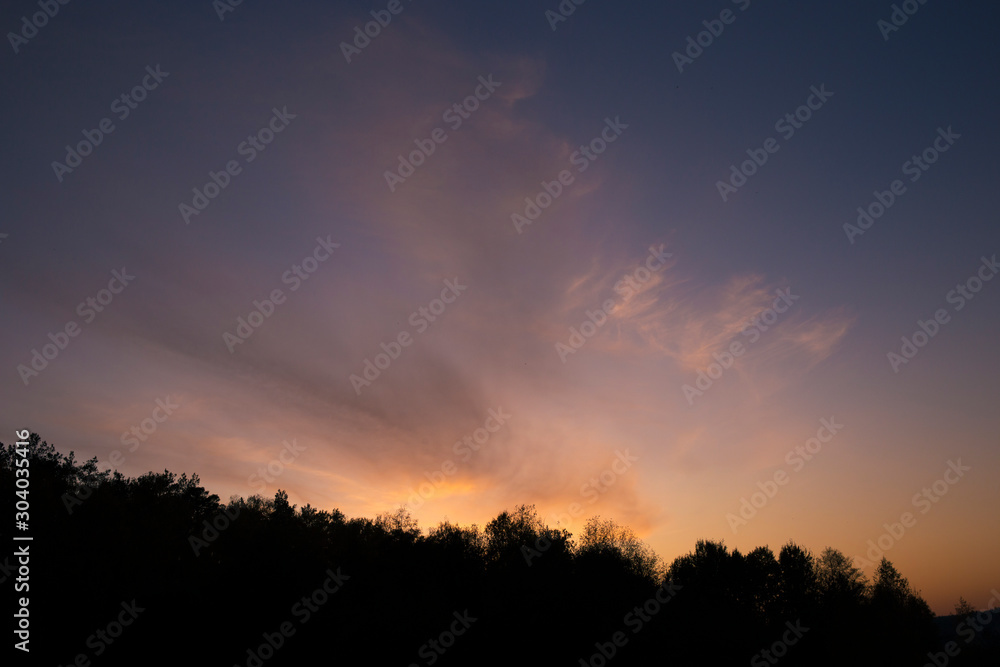 Autumn sunset sky at blue hour