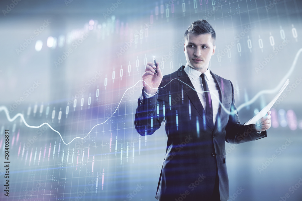 Businessman and forex graph hologram. Double exposure. Concept of financial education and analysis Businessman and forex graph hologram. Double exposure. Concept of financial education and analysis
