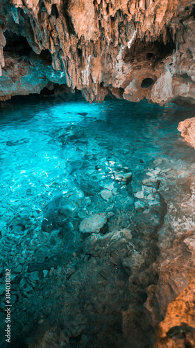 The crystal blue water in the rainbow cenote