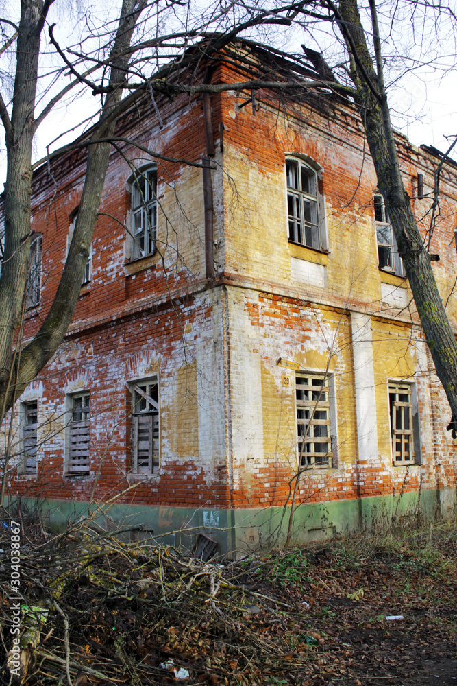  Old non-residential brick building behind the trees.