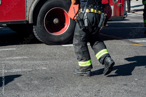 Unrecognizable firefighter working on a New York street