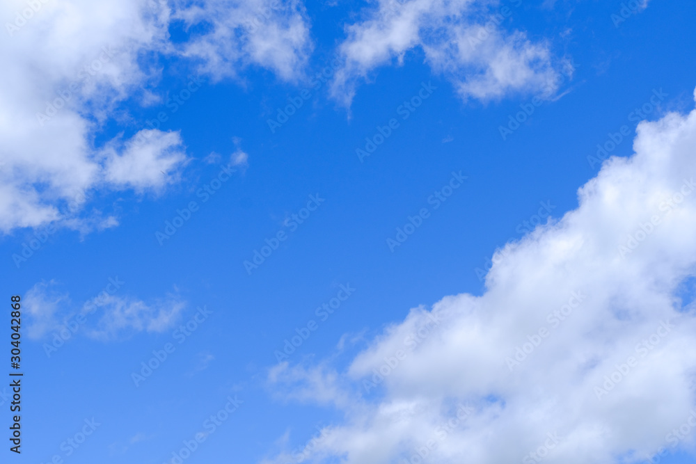 Beautiful blue sky with white gorgeous fluffy cloudy flowing with the wind Beautiful blue sky with white gorgeous fluffy cloudy flowing with the wind