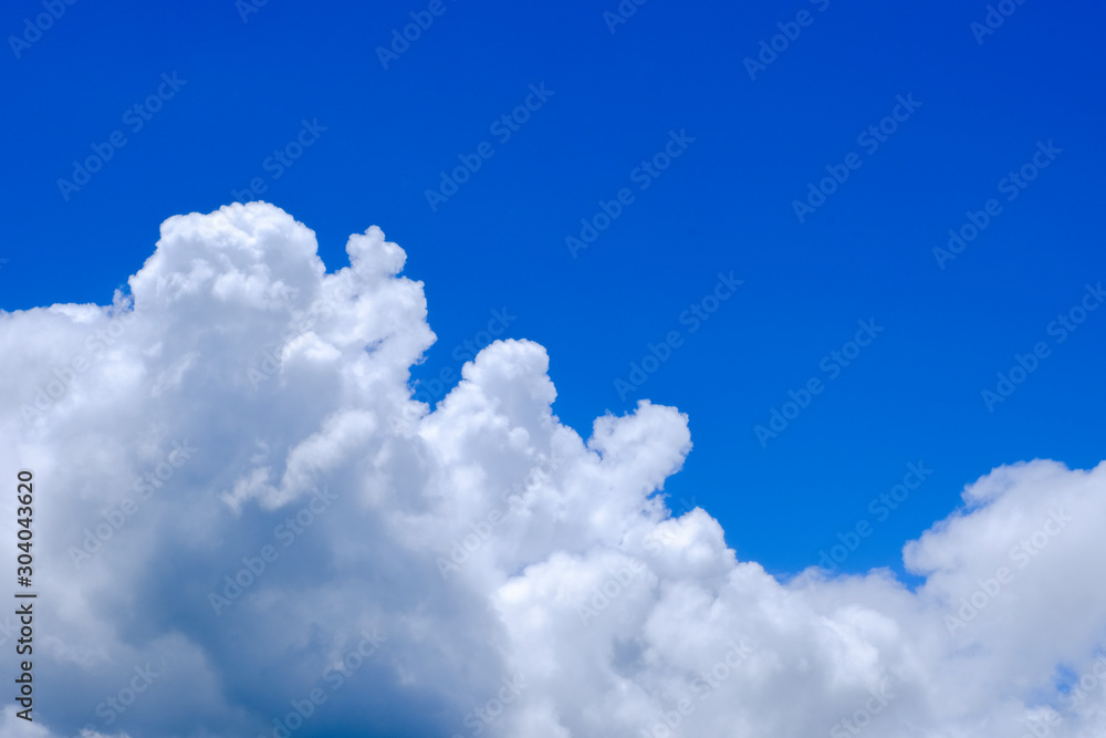 Beautiful blue sky with white gorgeous fluffy cloudy flowing with the wind Beautiful blue sky with white gorgeous fluffy cloudy flowing with the wind