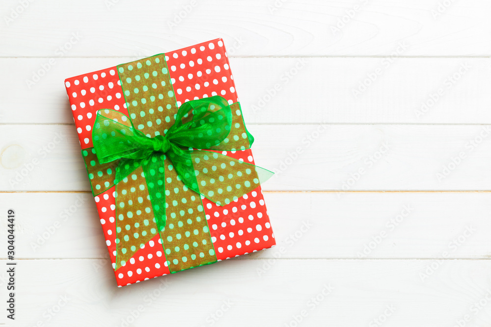 Top view of christmas or other holiday handmade present box package, flat lay white wooden background with copy space. new year gift box Top view of christmas or other holiday handmade present box package, flat lay white wooden background with copy space. new year gift box