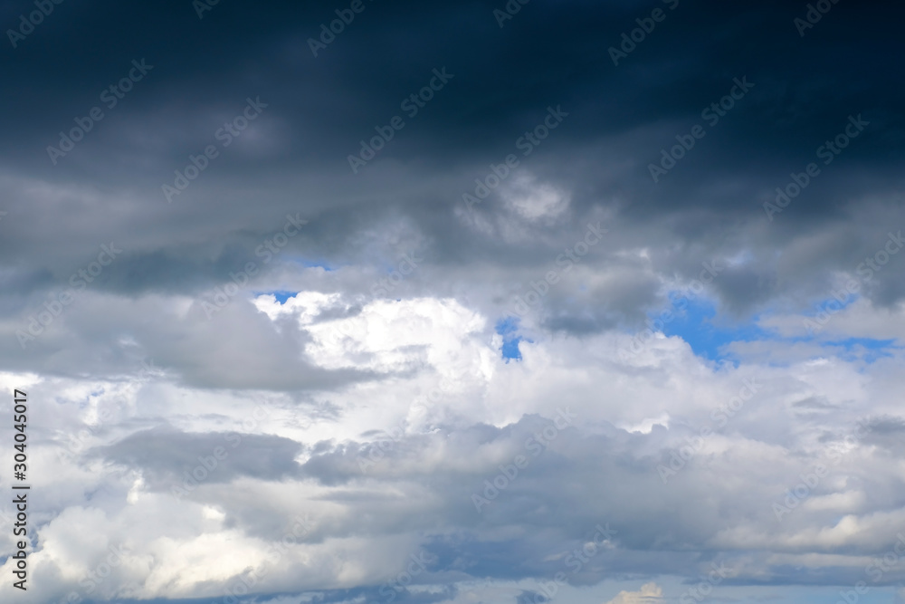 Beautiful blue sky with white gorgeous and dark fluffy cloudy flowing with the wind Beautiful blue sky with white gorgeous and dark fluffy cloudy flowing with the wind