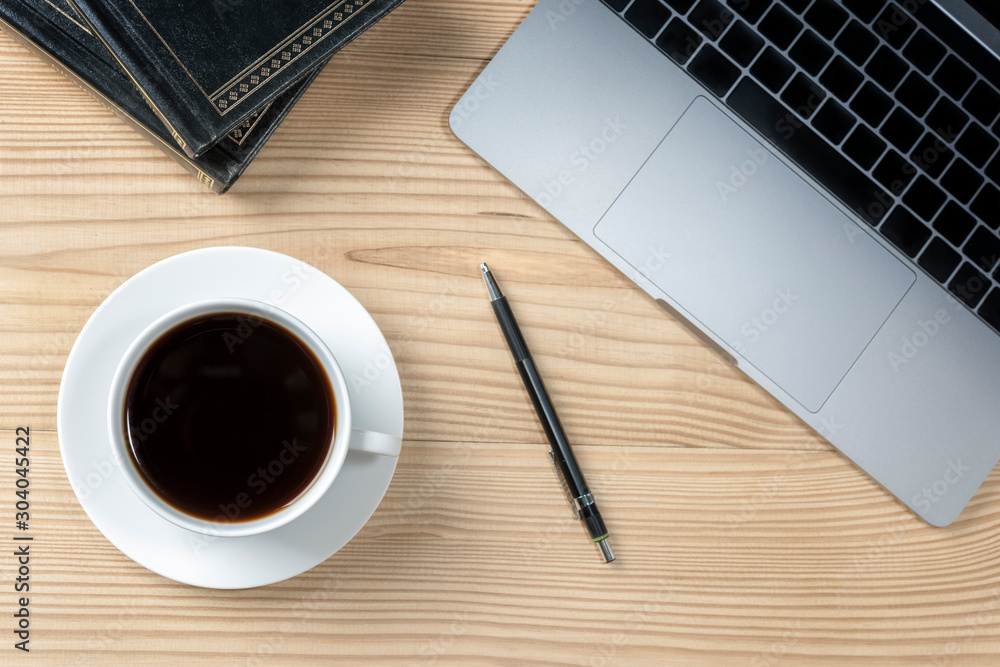 office table with notebook, computer keyboard, pen, cup of americano hot coffee. copy space office table with notebook, computer keyboard, pen, cup of americano hot coffee. copy space