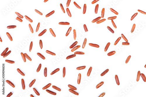 Scattered seeds of raw dry brown rice