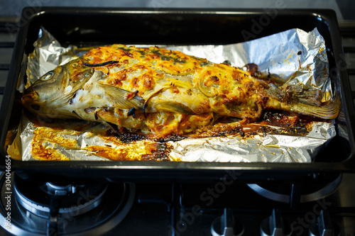 Baked fish with onions and cheese