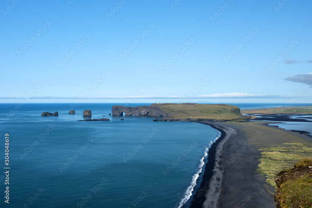 The Dyrholaey Peninsula in the south of Iceland. View of black sand beach near of the small town Vík. Iceland, Europe.