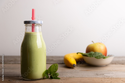 Homemade healthy smoothy made of spinach,banana and apple.