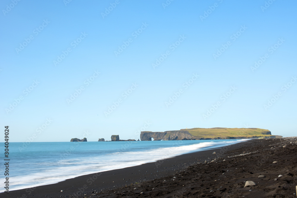 The Dyrholaey Peninsula in the south of Iceland. View of black sand beach near of the small town Vík. Iceland, Europe.